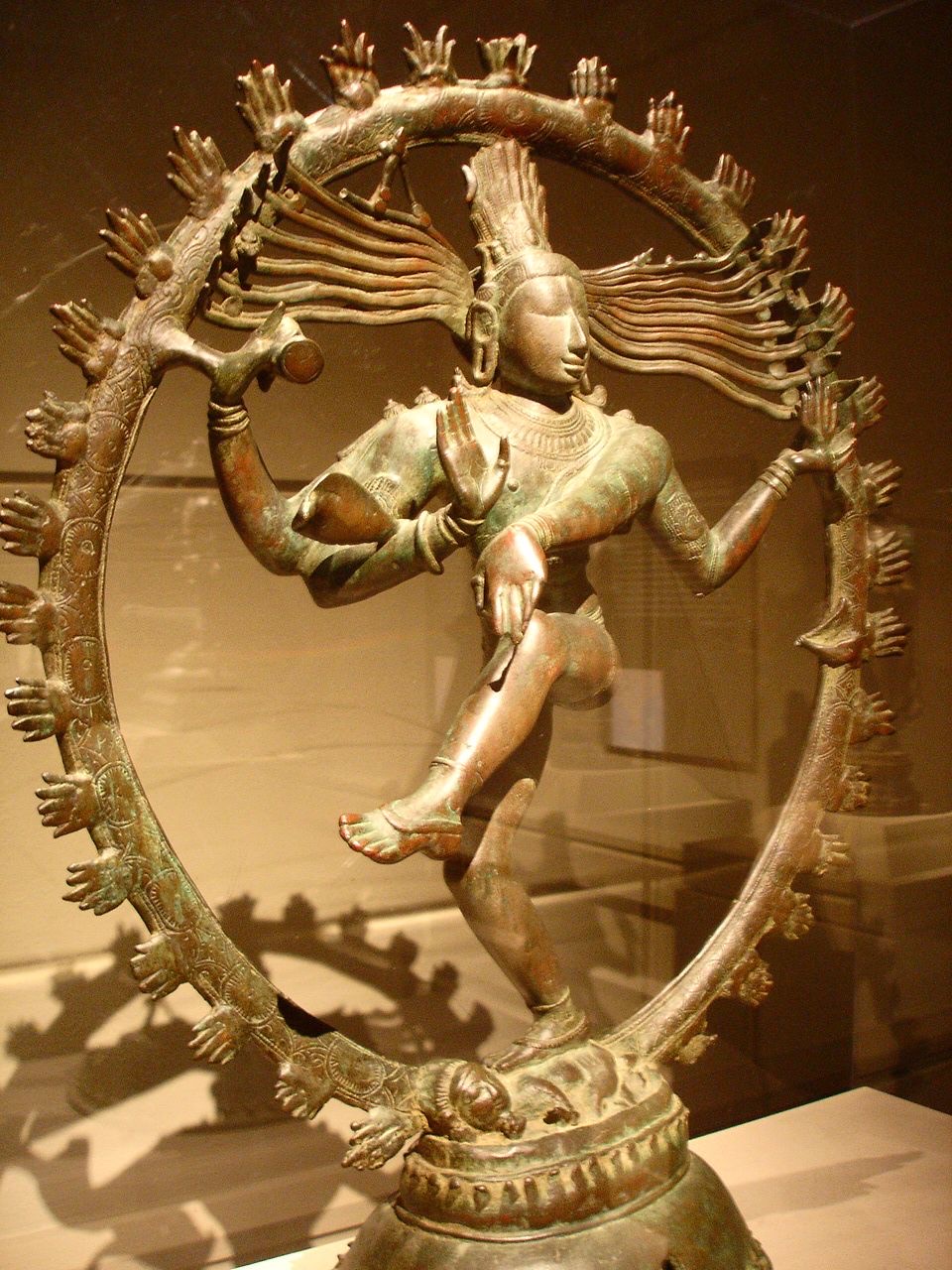 Reference: a Chola bronze in a museum vitrine